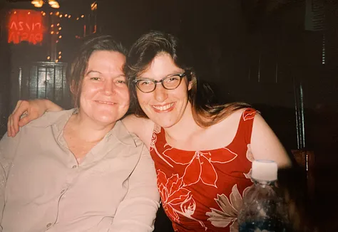 two women with their arms around each other