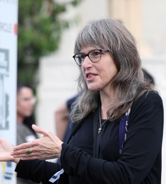 middle aged white woman gesturing with her hands